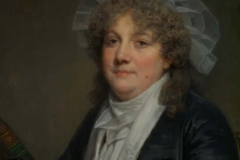 Tranh chân dung bà Jean-Baptiste Nicolet (Jean-Baptiste Greuze, cuối thập niên 1780), người phụ nữ điềm tĩnh bên bàn, minh họa bài về nữ lãnh đạo ngành truyền thông